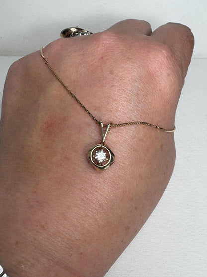 Vintage 14k gold pendant necklace with a diamond solitaire.