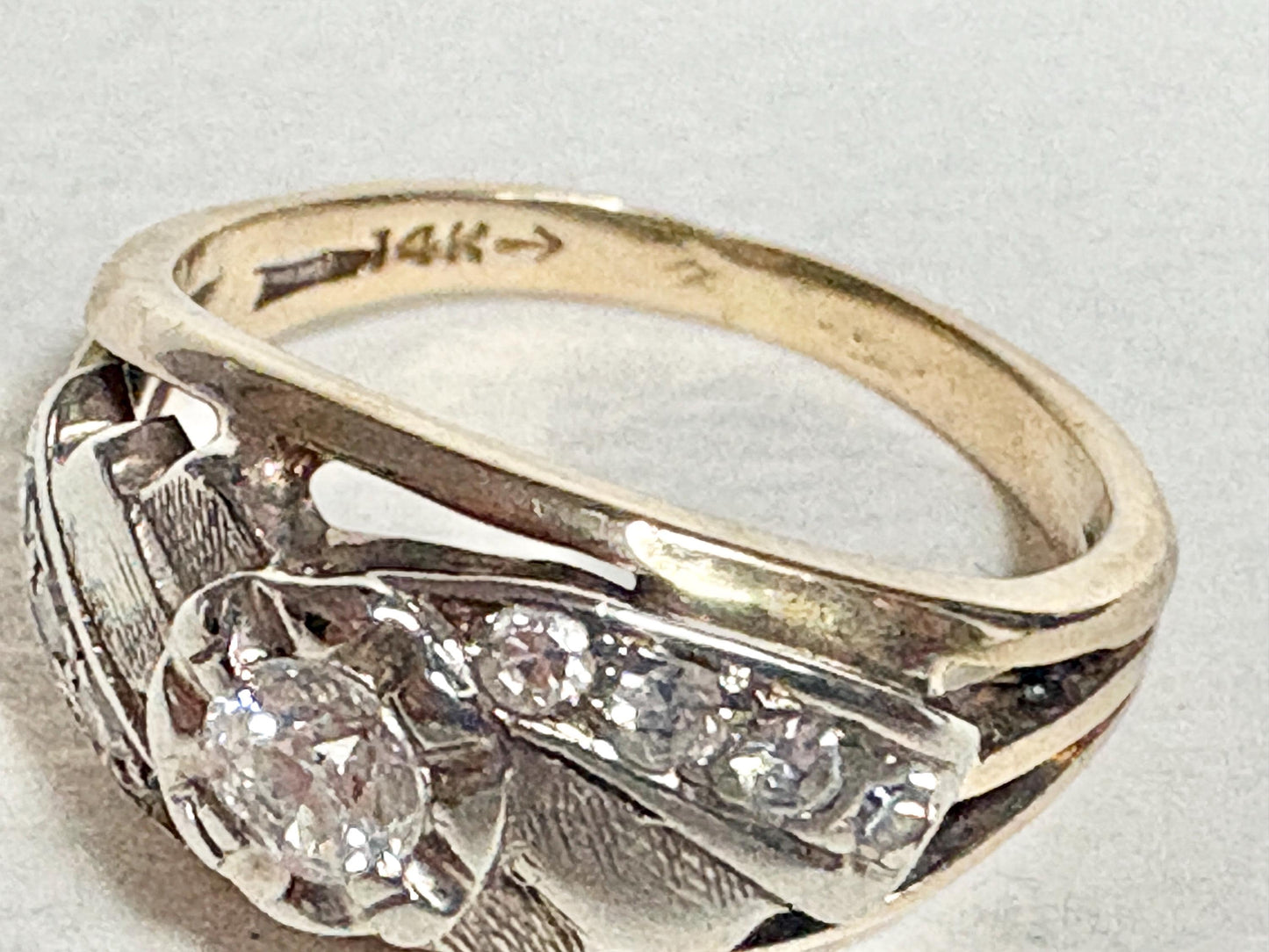 Mid-century 14k gold ring with diamonds and a two-tone design.