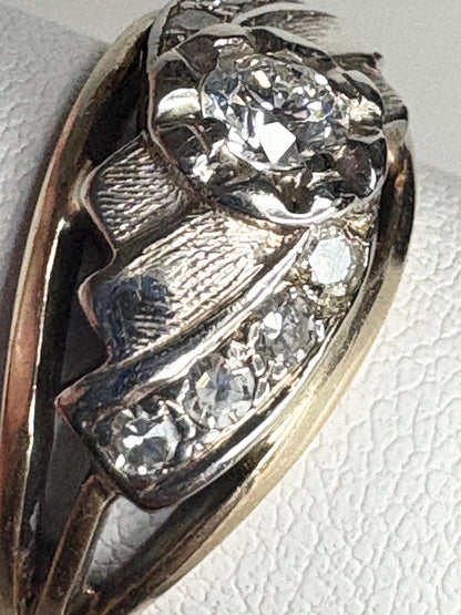 Mid-century two-tone 14k gold ring with diamonds and textured details.