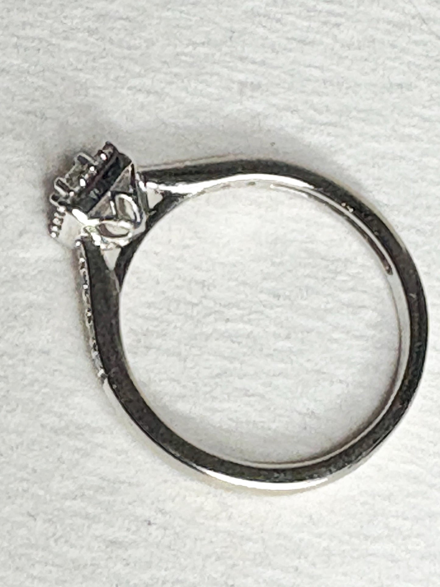 Princess cut diamond halo engagement ring in 10k white gold.