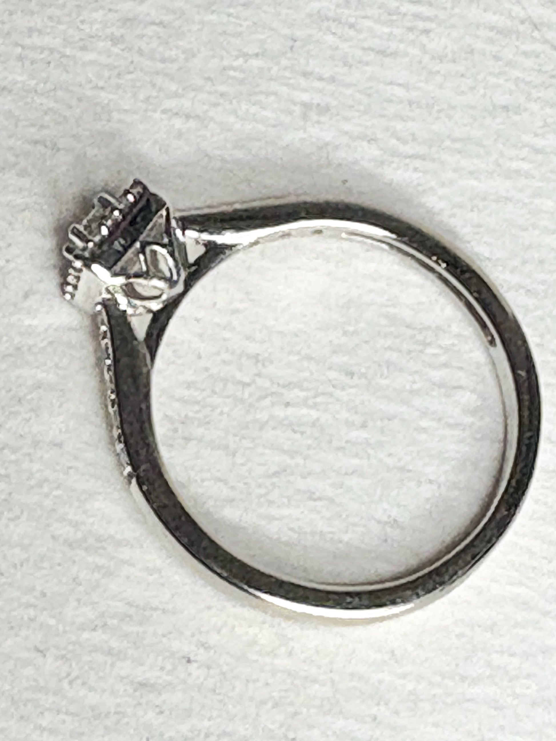 Princess cut diamond halo engagement ring in 10k white gold.