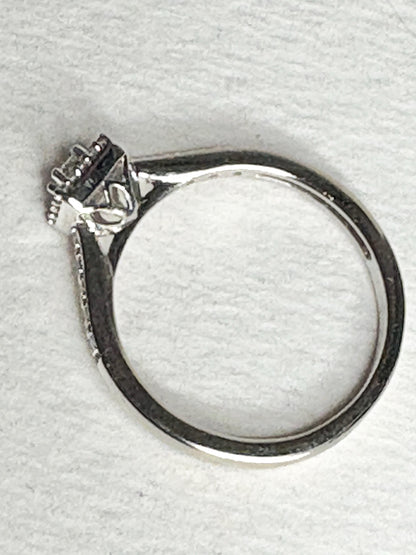 Princess cut diamond halo engagement ring in 10k white gold.