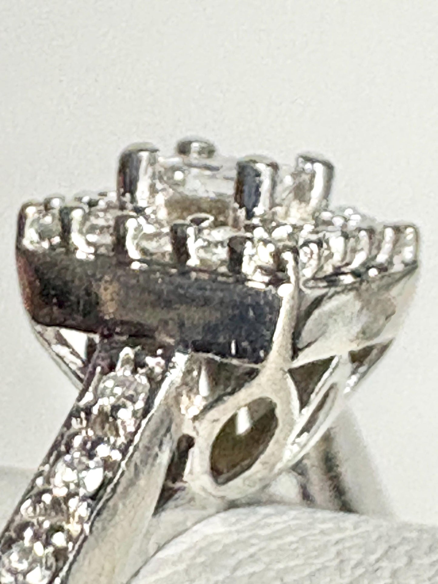 Princess cut diamond halo engagement ring in 10k white gold.