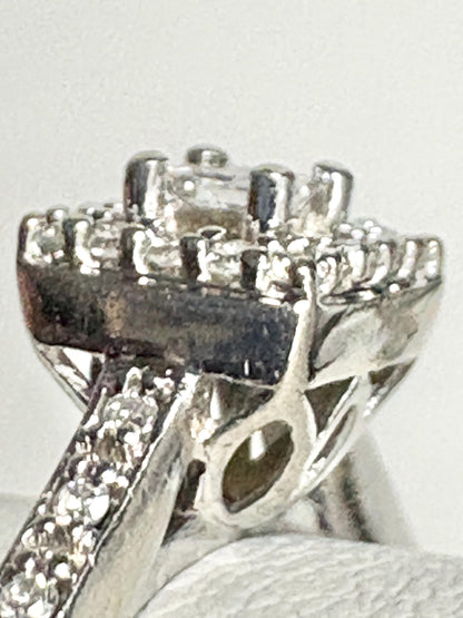 Princess cut diamond halo engagement ring in 10k white gold.
