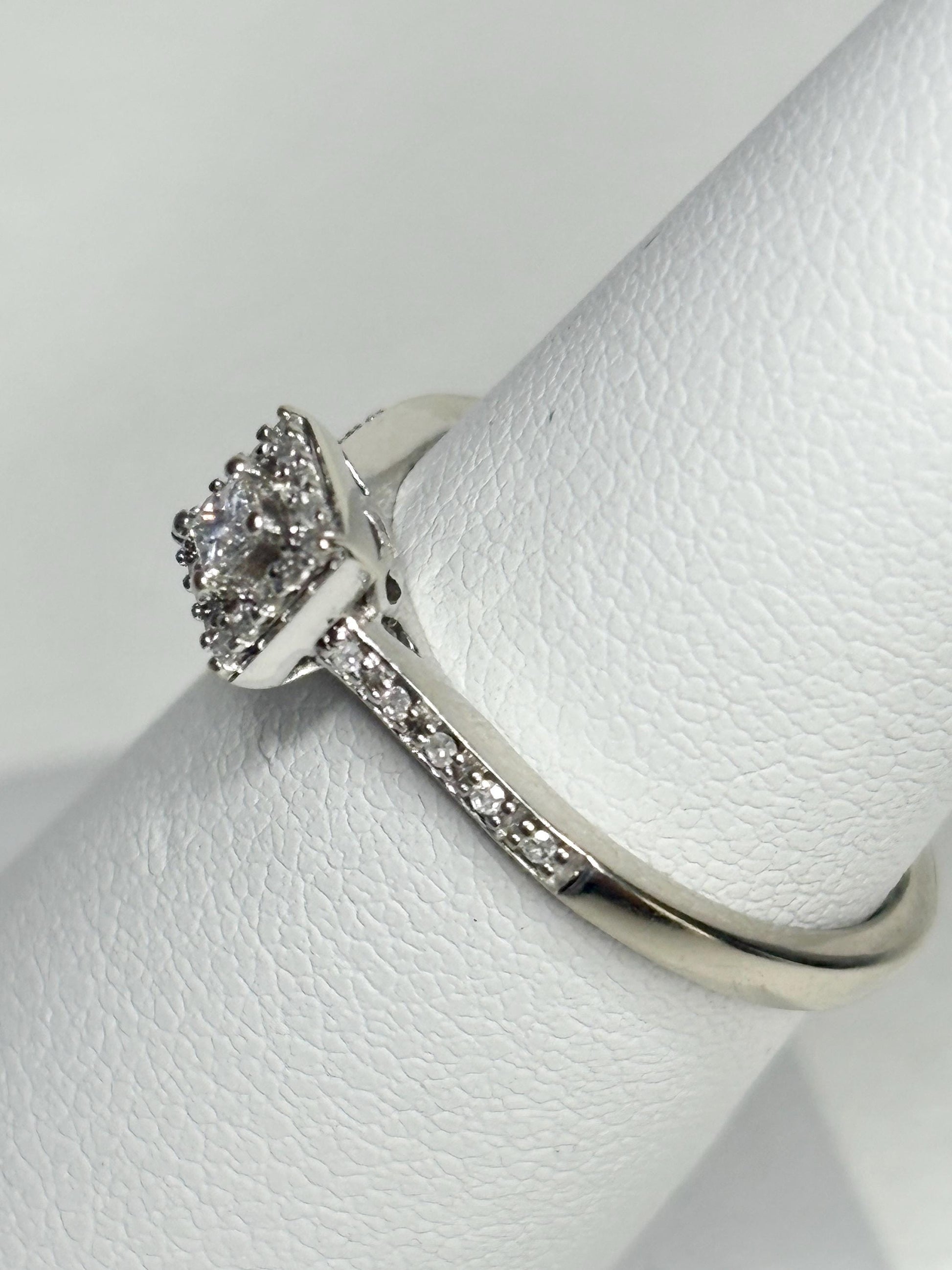Princess cut diamond halo ring in 10k white gold.