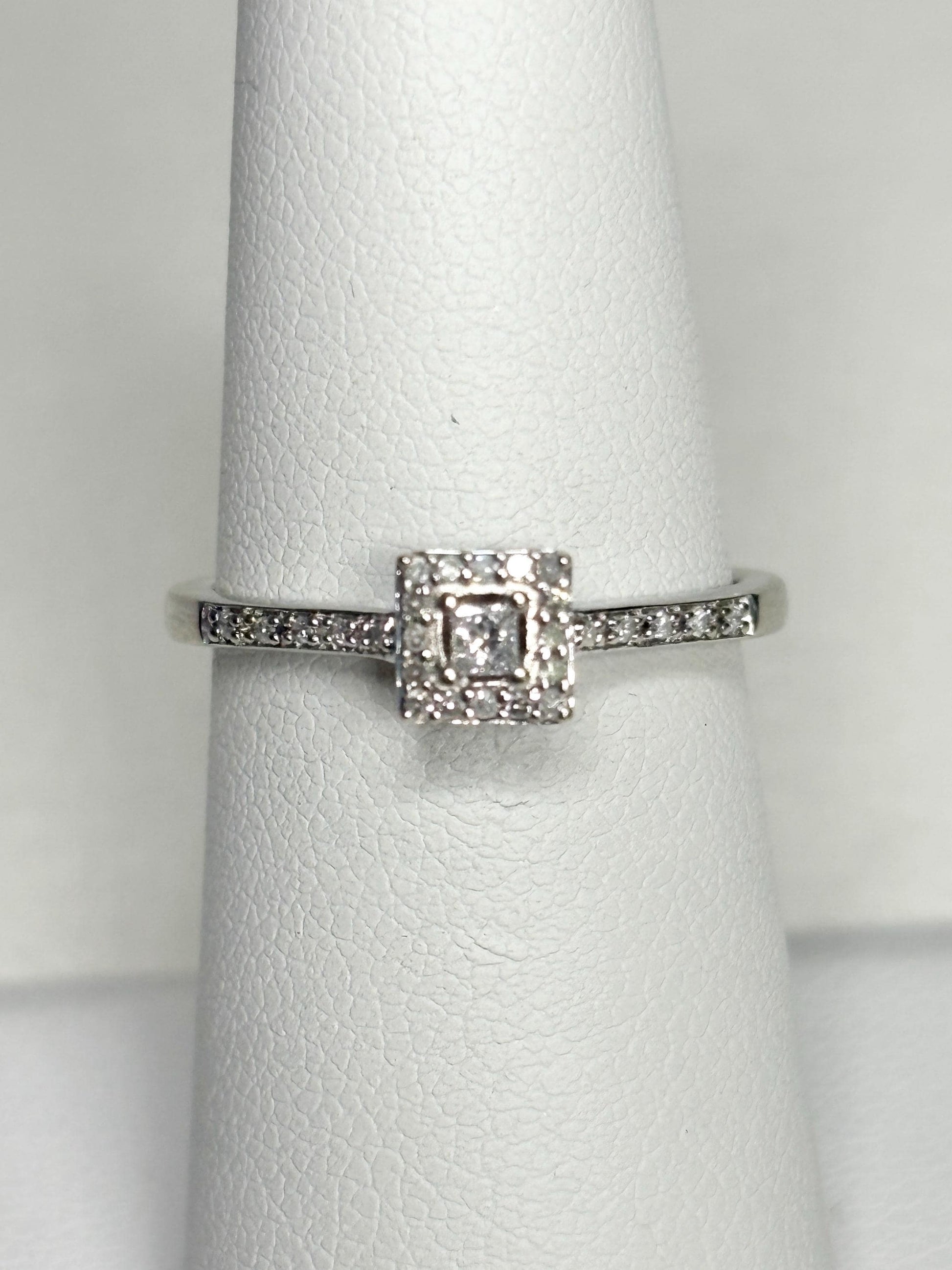 Princess cut diamond halo ring in 10k white gold.