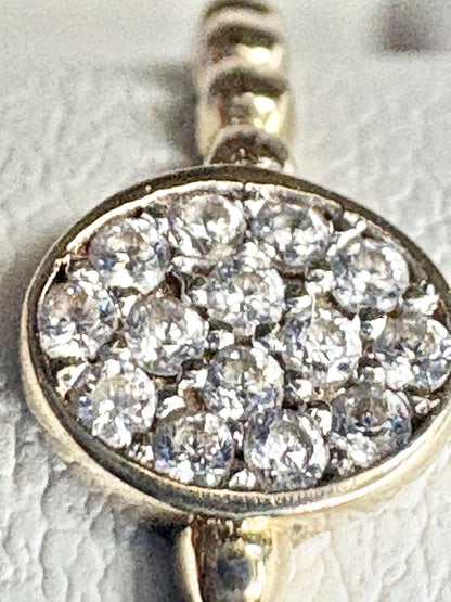 Dainty oval ring with pave-set crystals and a beaded band in solid 14k gold.