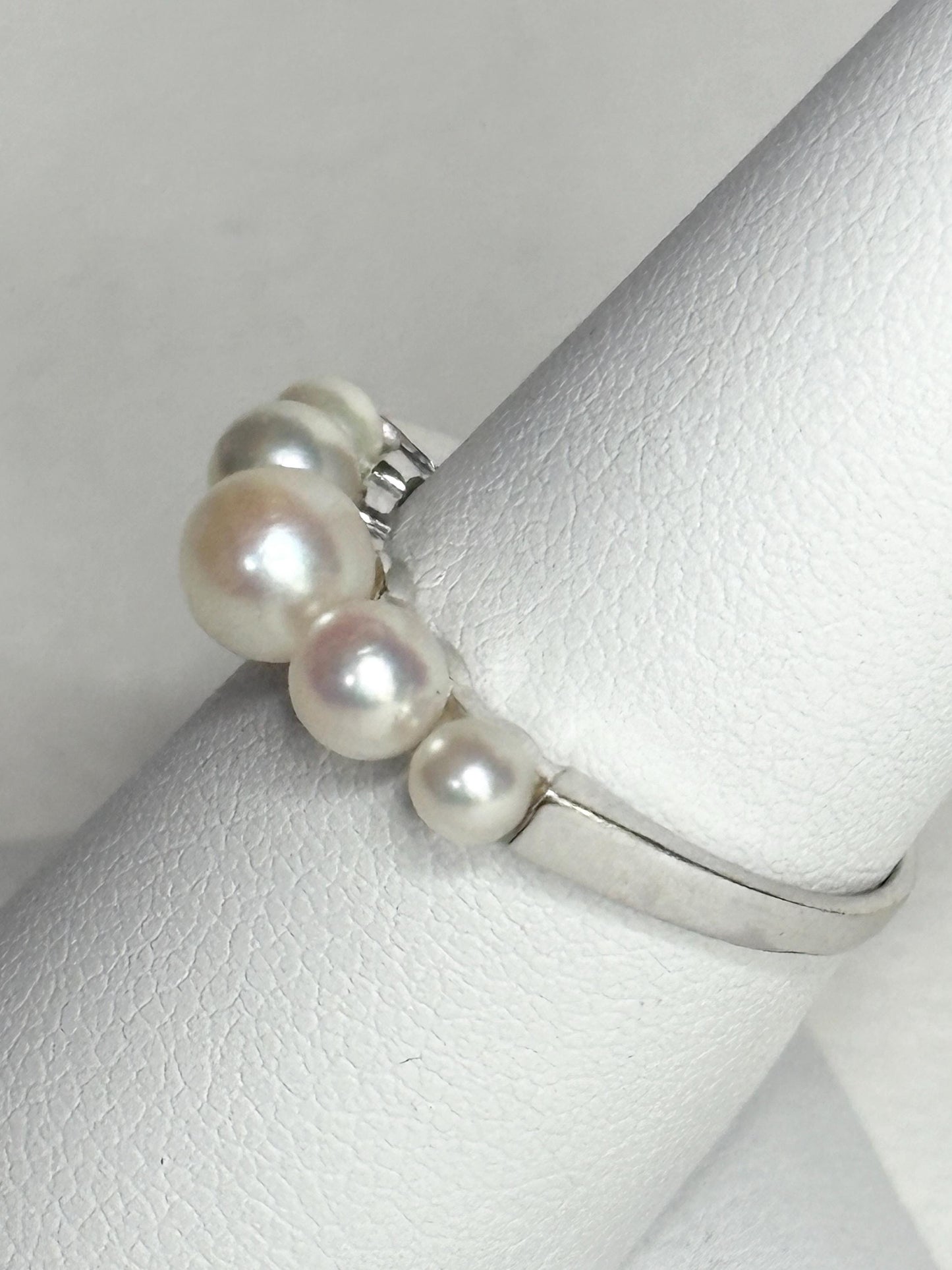 18k white gold band ring with five Japanese Akoya cultured pearls.