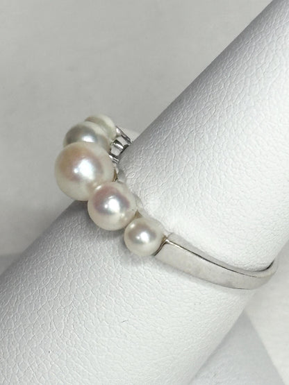 18k white gold band ring with five Japanese Akoya cultured pearls.