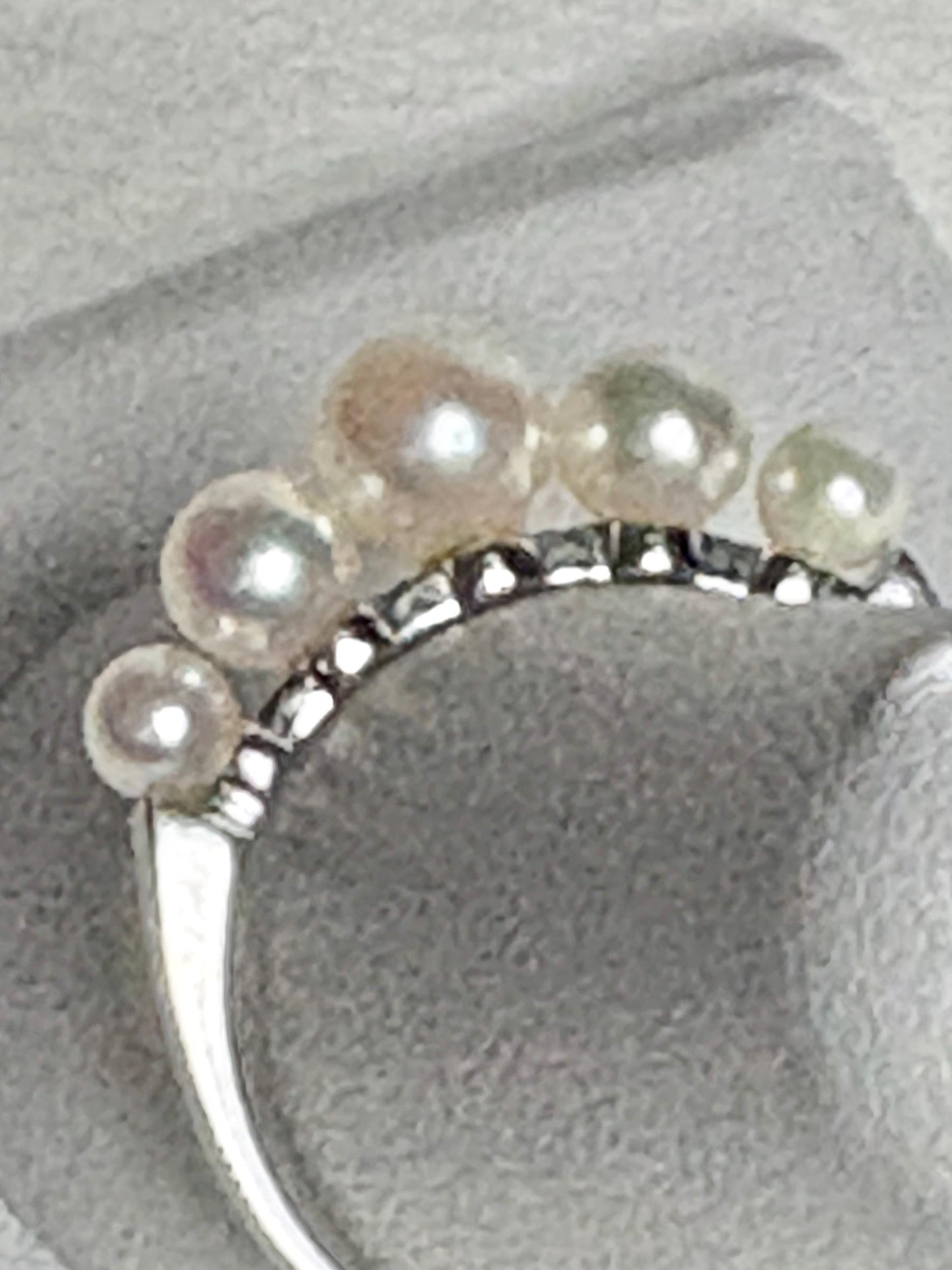 18k white gold band ring with five Japanese Akoya pearls.
