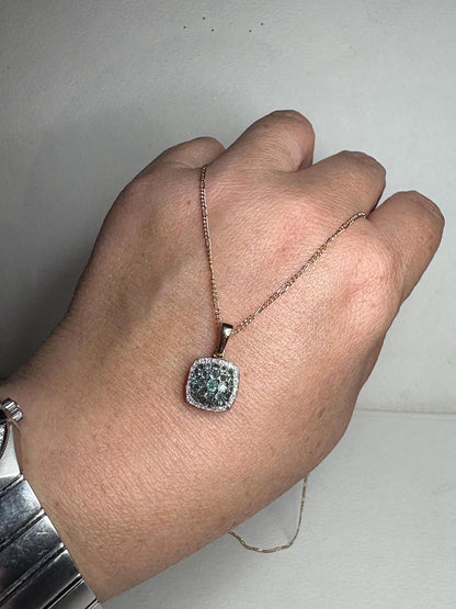 14k gold pendant necklace with a cushion-shaped cluster of alexandrite and diamond stones.