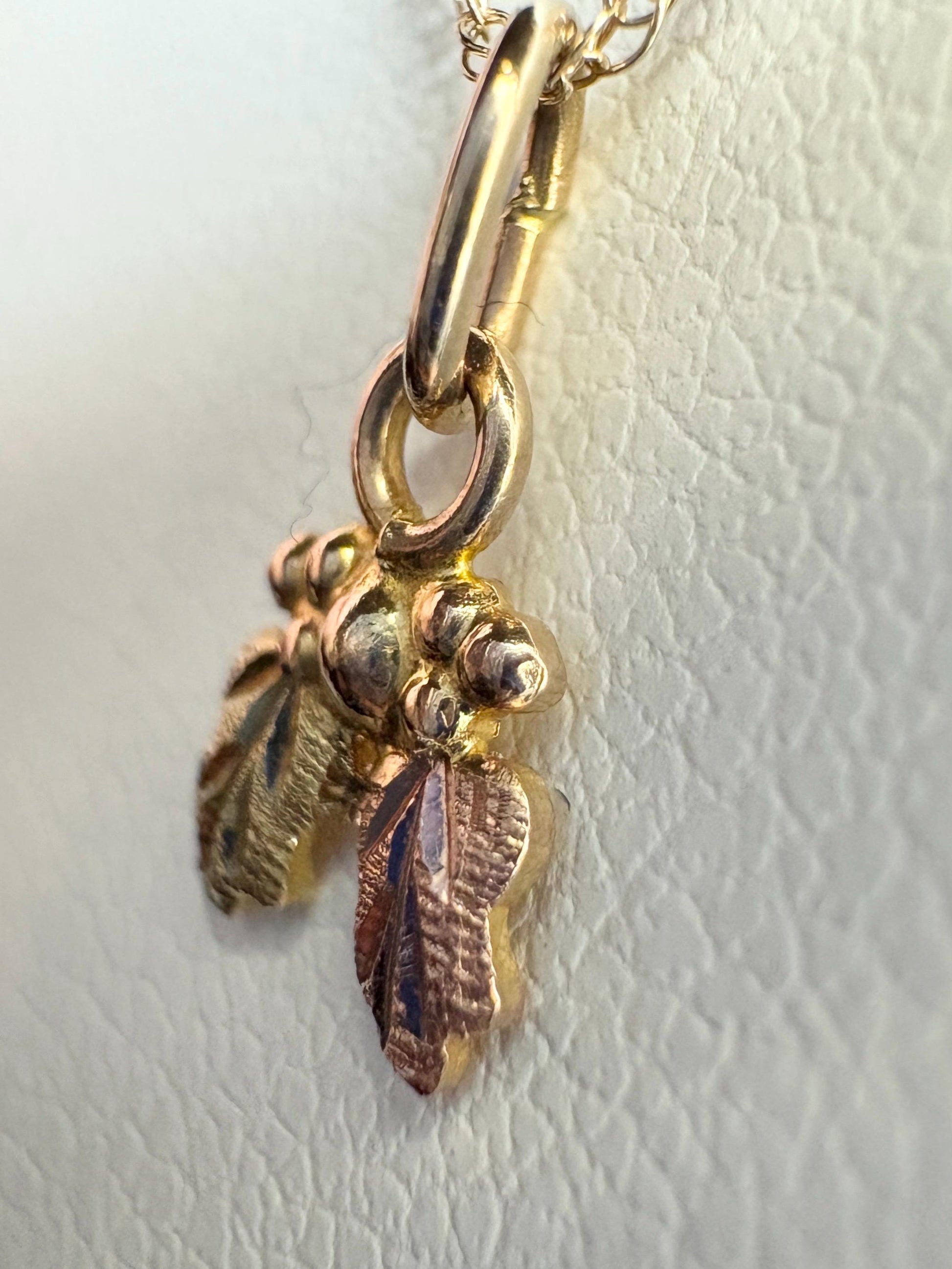 Dainty Black Hills Gold pendant necklace in solid 10k yellow, rose, and green gold.