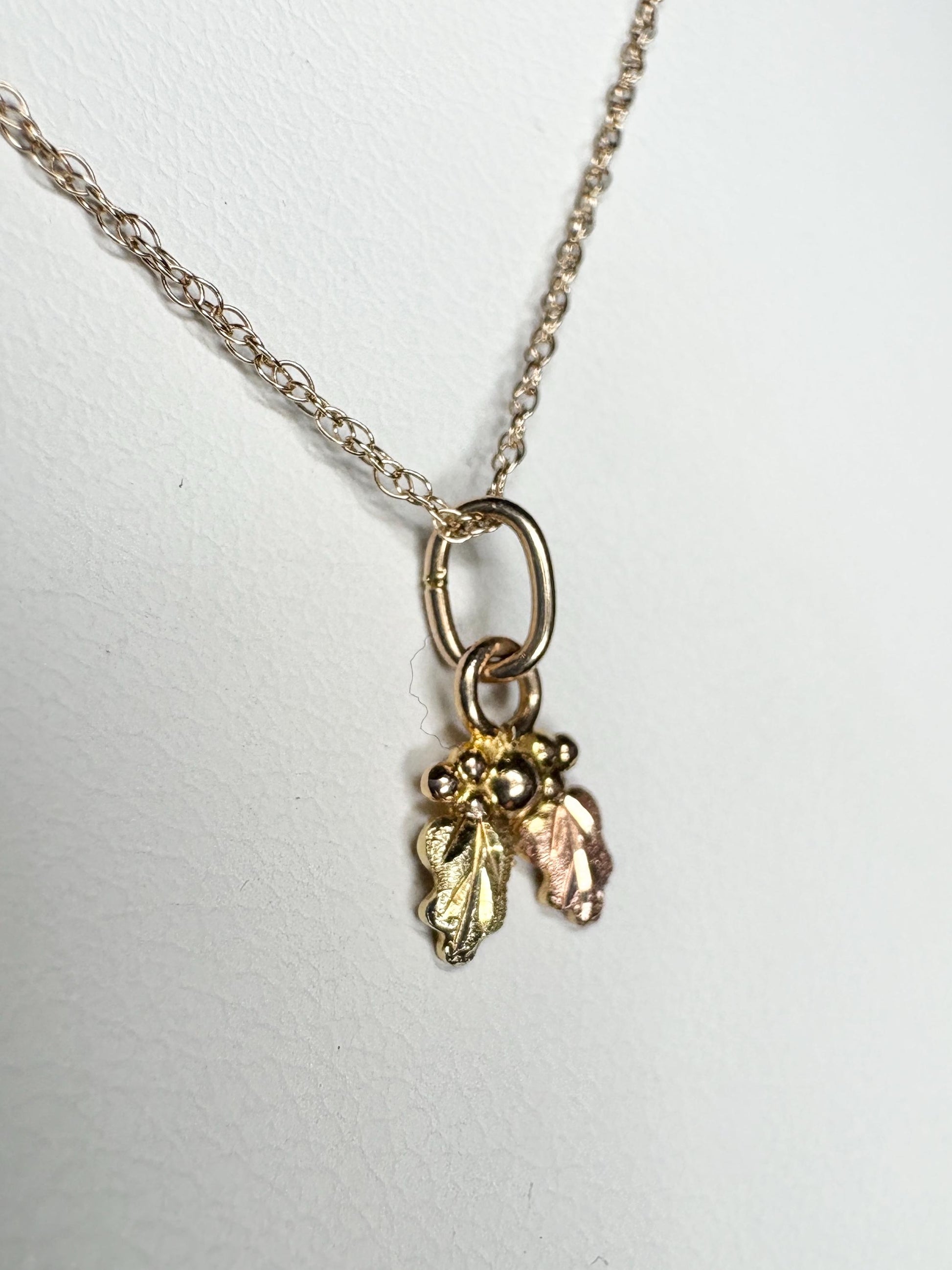 Dainty tiny Black Hills Gold pendant necklace in solid 10k gold on an 18" chain.