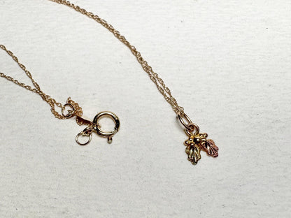 Dainty 10k gold Black Hills Gold pendant necklace with a spring ring clasp.