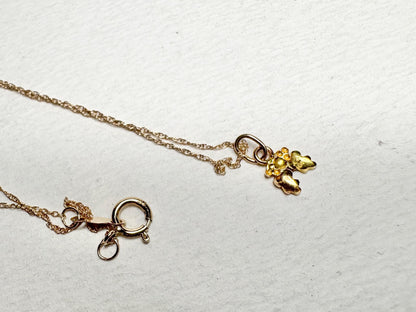 Dainty 10k gold necklace with a Black Hills Gold pendant and spring ring clasp.