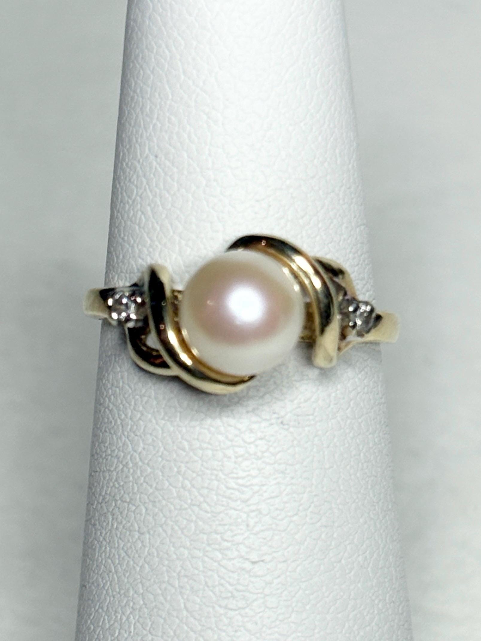 10k gold ring with Akoya pearl and two diamonds.