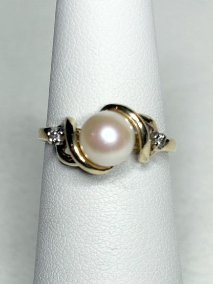 10k gold ring with Akoya pearl and two diamonds.