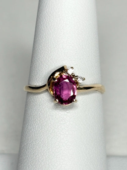 Pink sapphire and diamond ring in 14k gold.