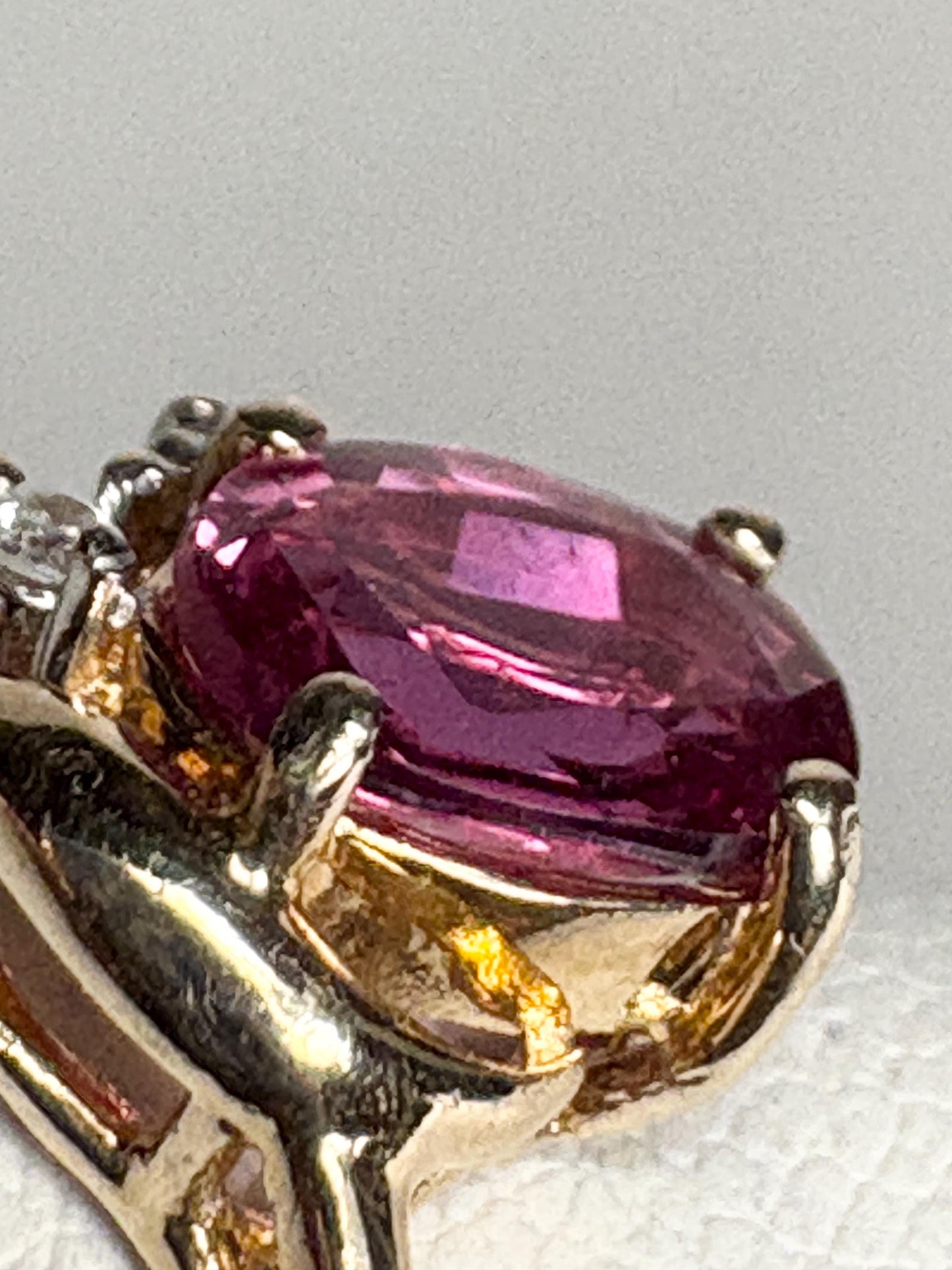 Pink sapphire and diamond ring in 14k gold.