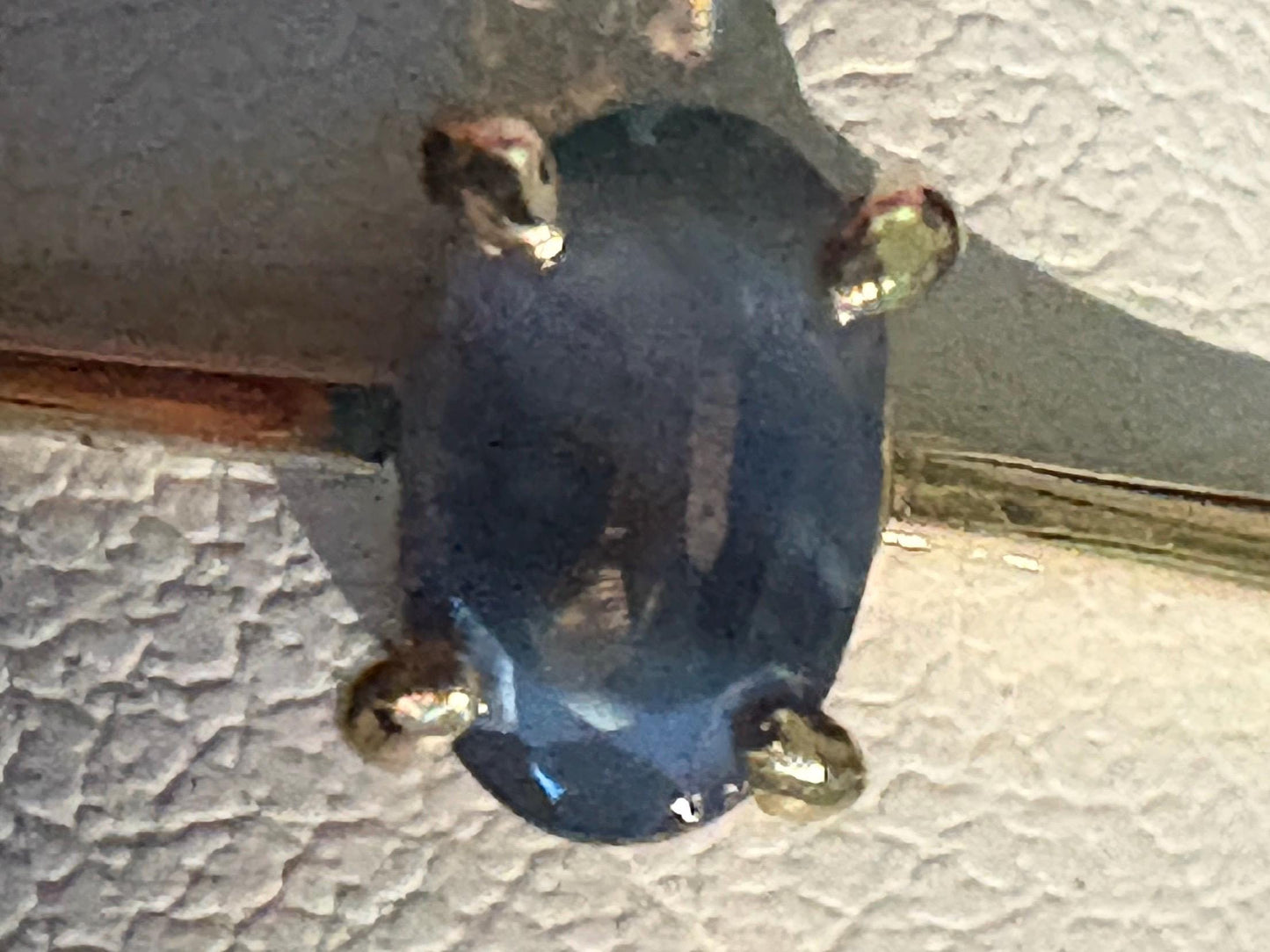 Oval alexandrite chrysoberyl solitaire ring in 10k gold.