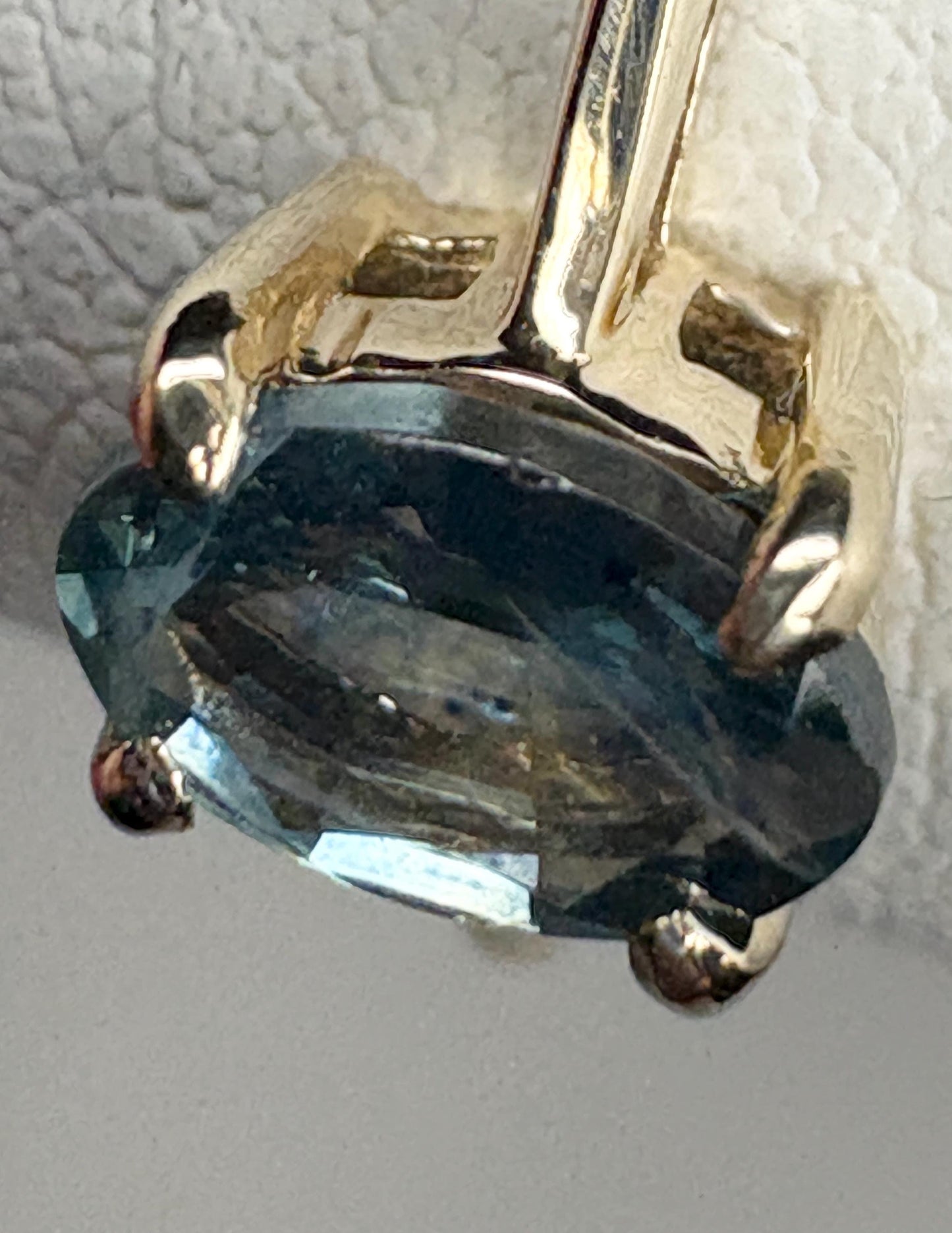 Oval Montana sapphire solitaire ring in solid 10k gold.