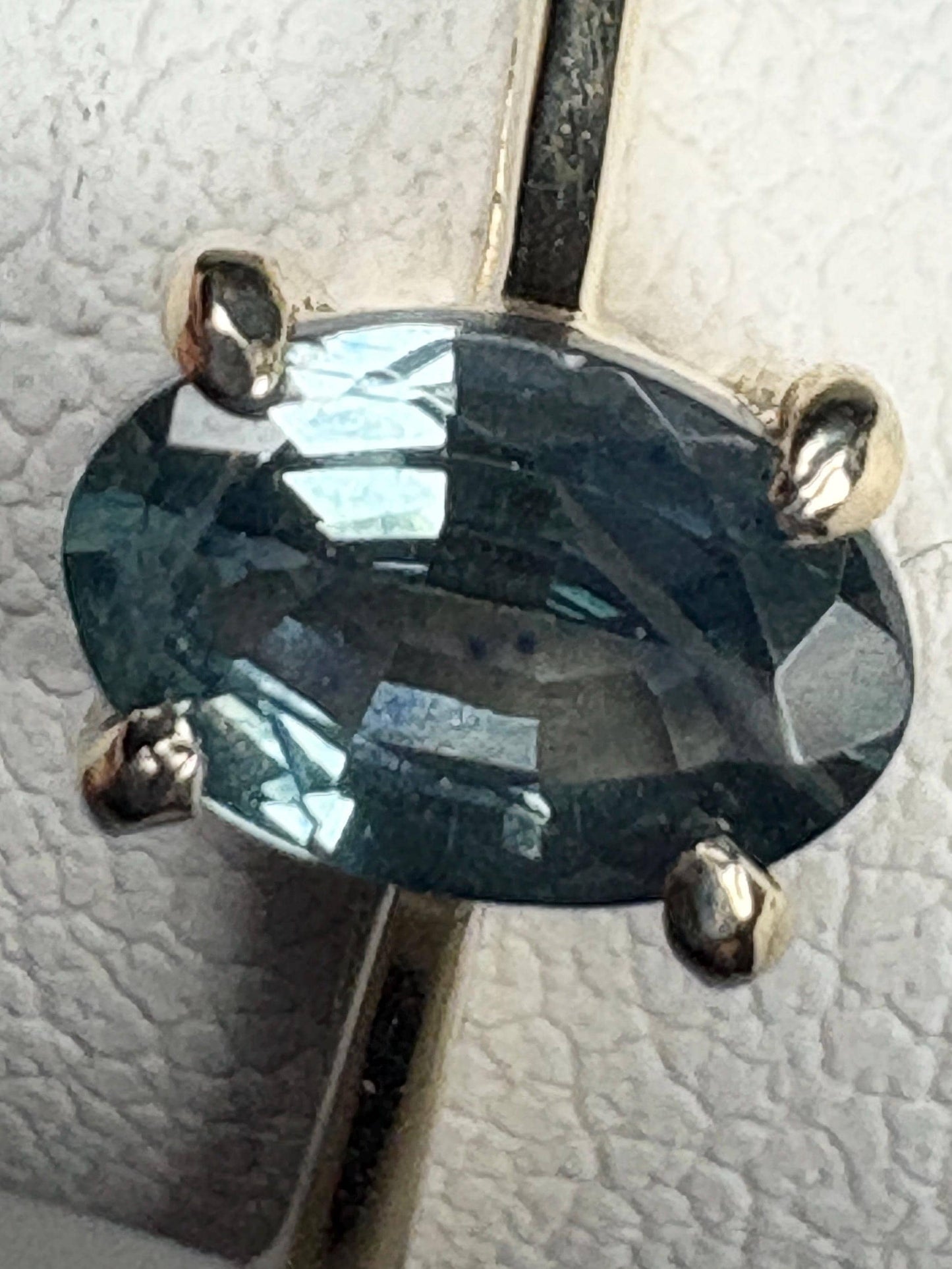 Oval Montana sapphire solitaire ring in solid 10k gold.