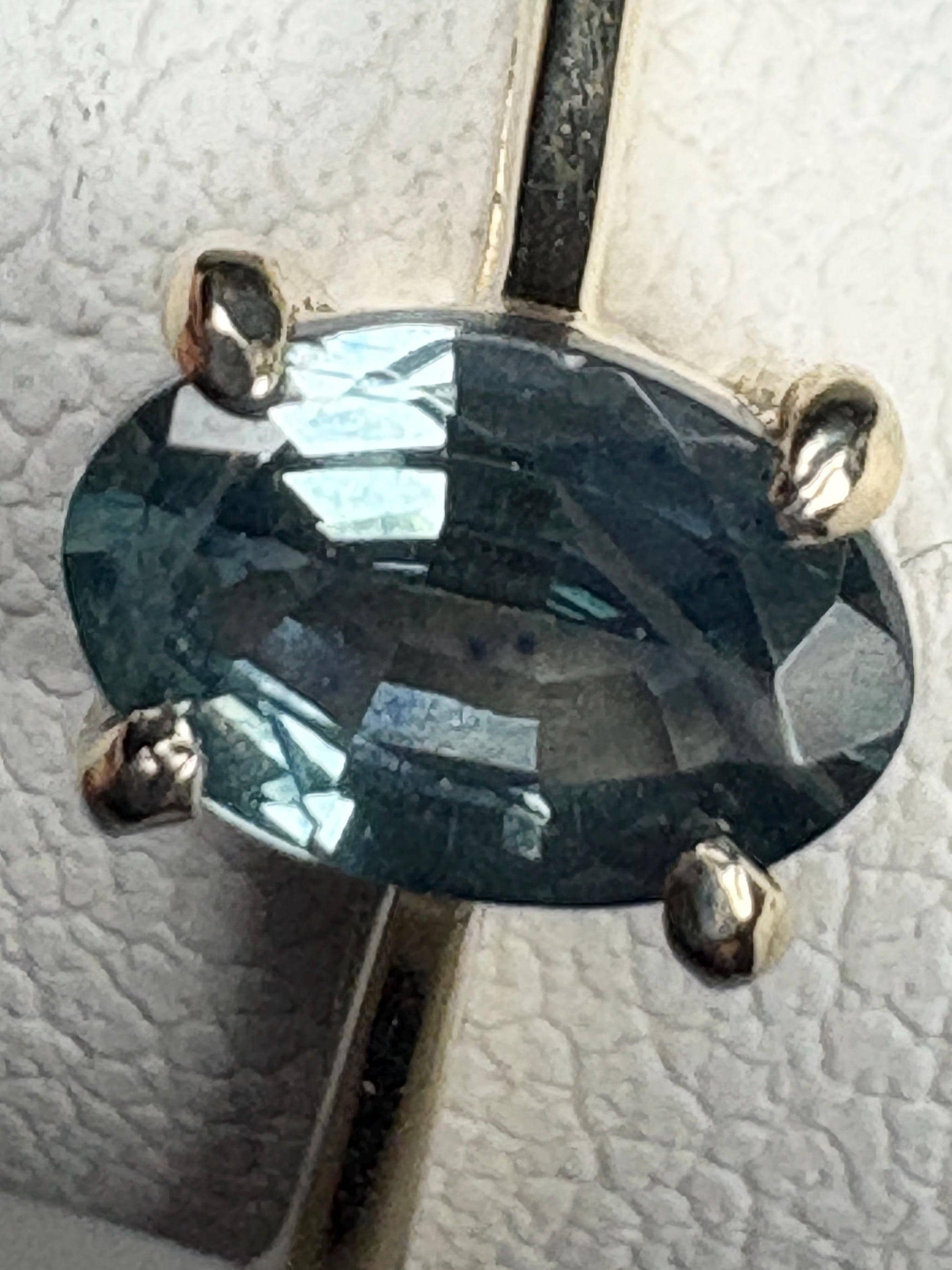 Oval Montana sapphire solitaire ring in solid 10k gold.