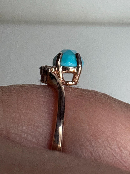 Rose gold ring with checkerboard faceted turquoise and diamonds.