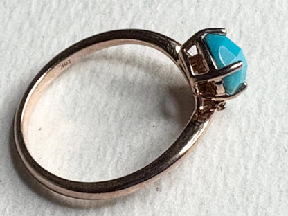10k rose gold ring with a checkerboard faceted turquoise stone.