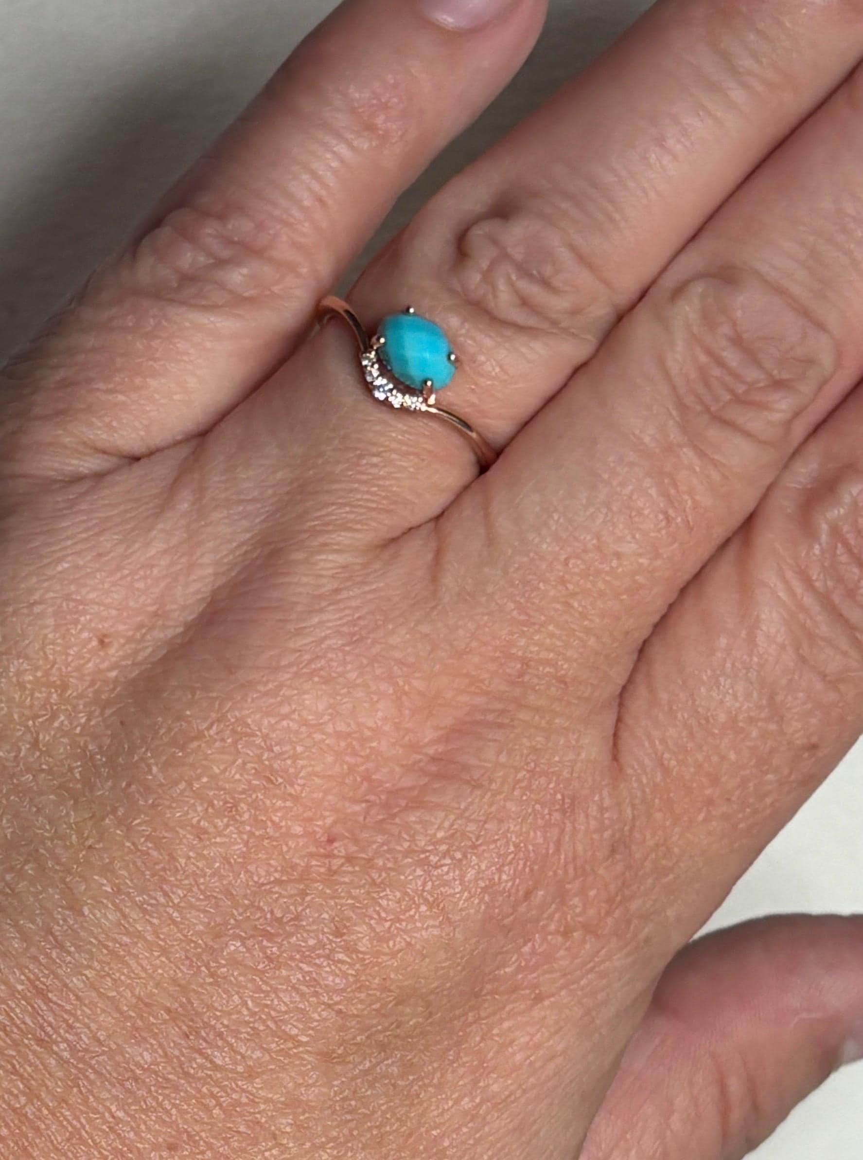 10k rose gold ring with oval checkerboard turquoise and diamonds.
