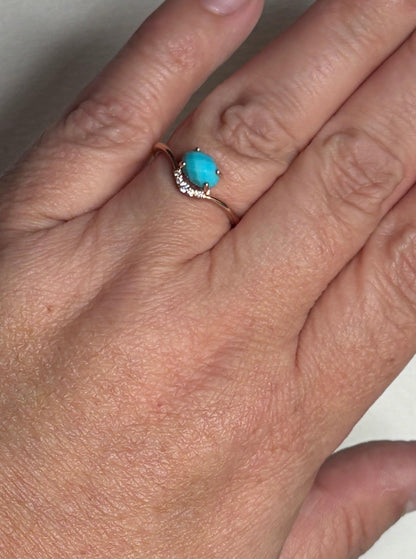 10k rose gold ring with oval checkerboard turquoise and diamonds.