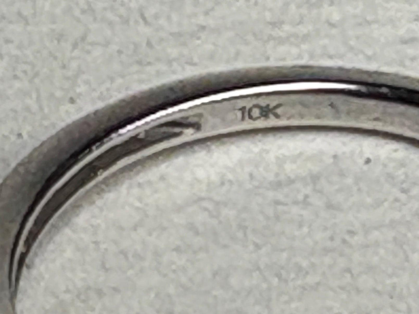 A 10k white gold ring with a hallmark.