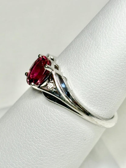 Oval rubellite tourmaline and diamond ring in 10k white gold.