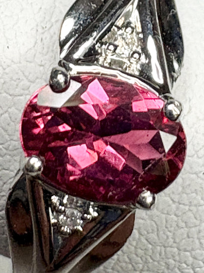 Oval rubellite tourmaline and diamond ring in 10k white gold.