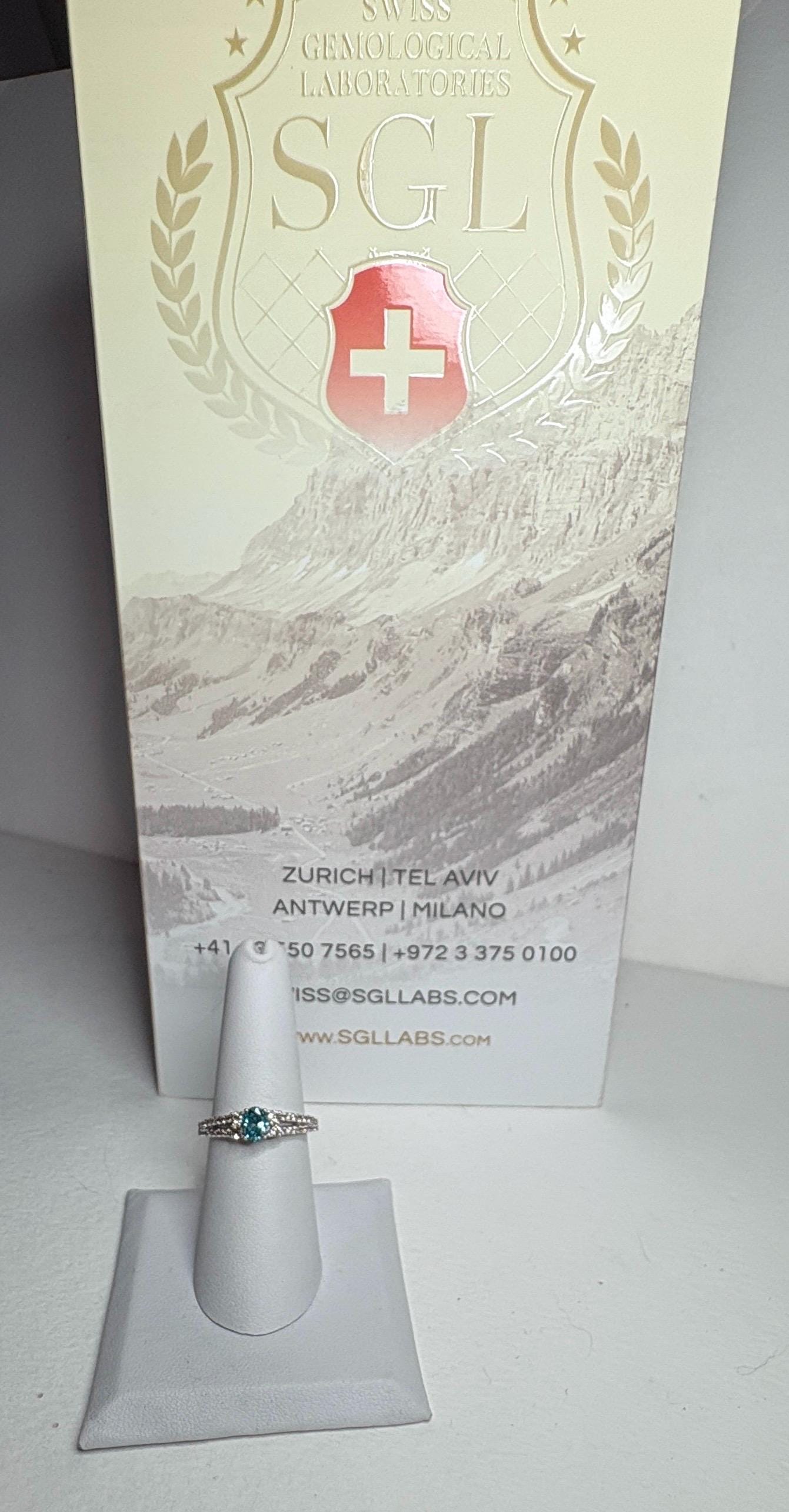 LeVian white gold ring with blue and champagne diamonds.