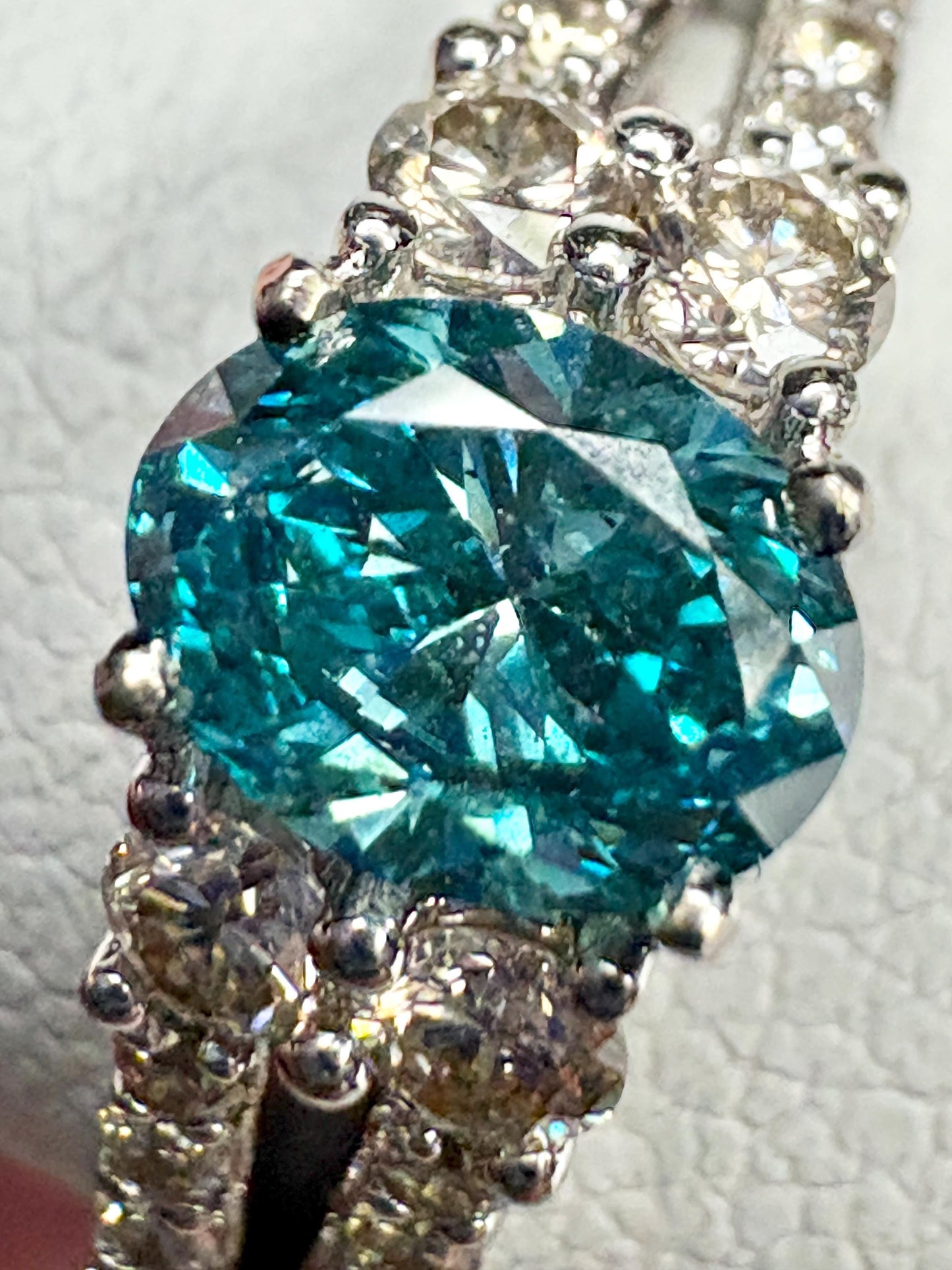 LeVian 14k white gold ring with a blue diamond and champagne diamonds.