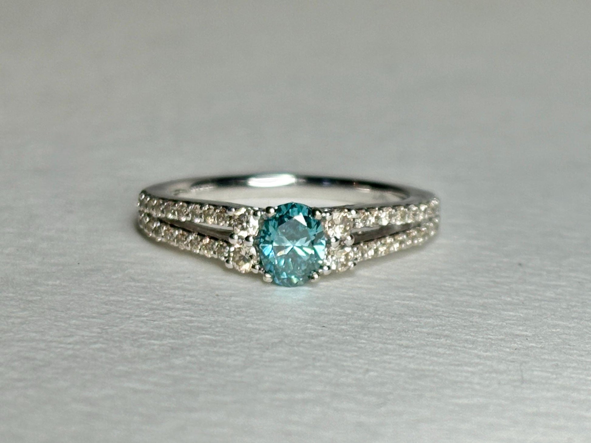 LeVian 14k white gold ring with a blue diamond and champagne diamonds.