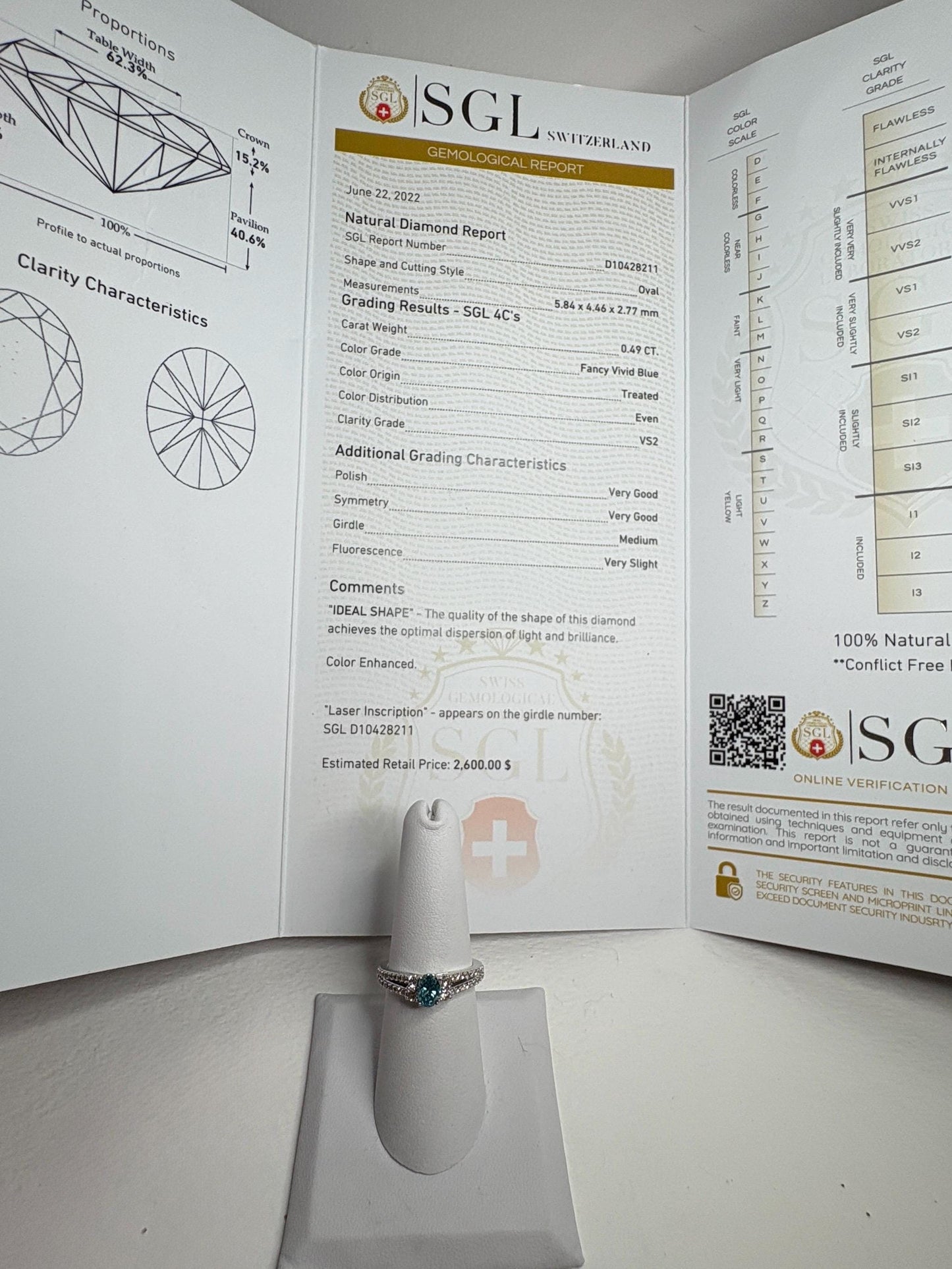 LeVian ring with SGL certified blue diamond and champagne diamonds in white gold.