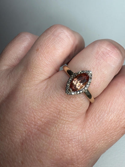 Ring with marquise Oregon sunstone and champagne diamonds in 10k gold.