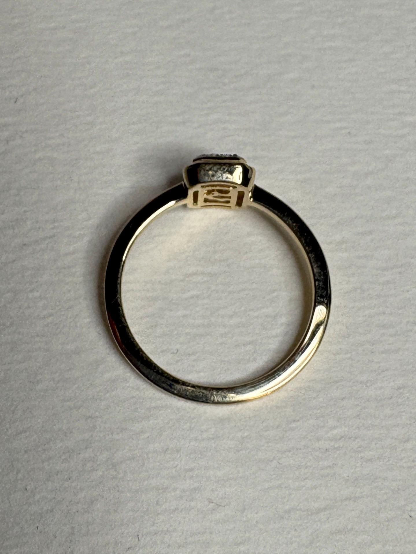 Effy 14k yellow gold ring with a bezel-set baguette diamond and diamond halo.