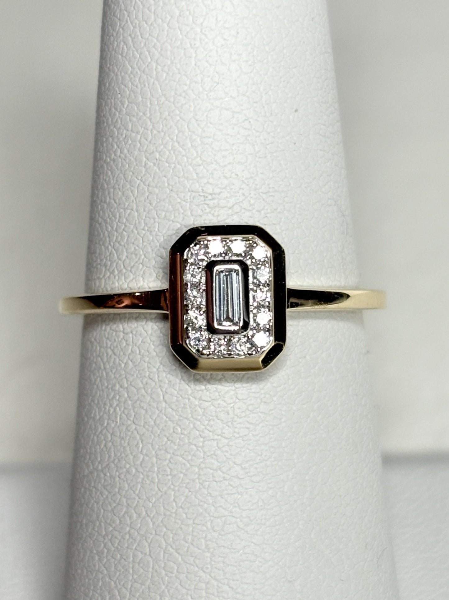 Effy 14k yellow gold ring with a baguette diamond surrounded by smaller diamonds.
