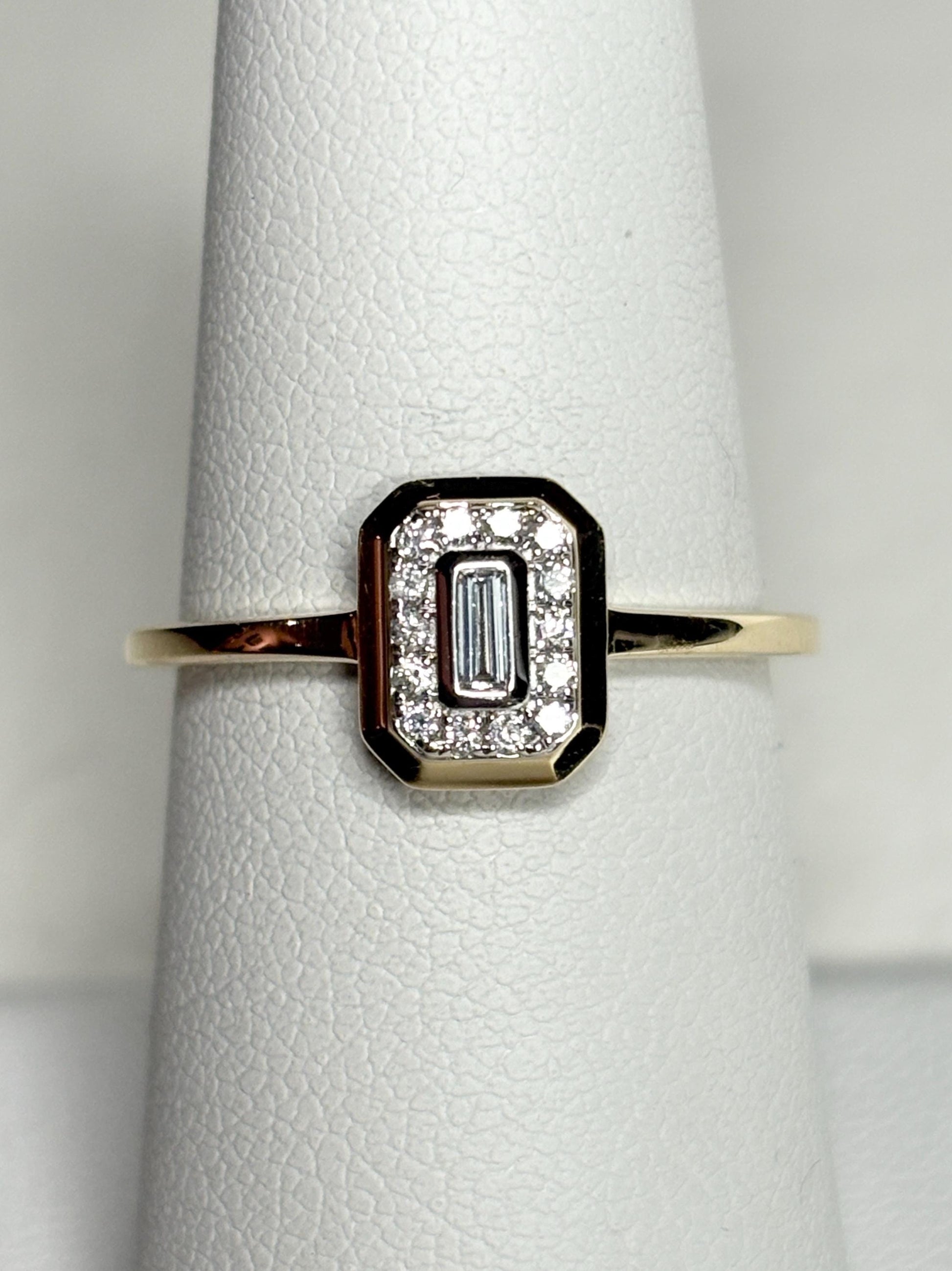 Effy 14k yellow gold ring with a baguette diamond surrounded by smaller diamonds.