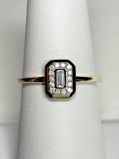 Effy 14k yellow gold ring with a baguette diamond surrounded by smaller diamonds.