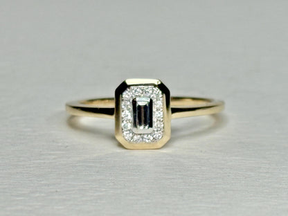 Effy 14k gold ring with a bezel-set baguette diamond surrounded by smaller diamonds.