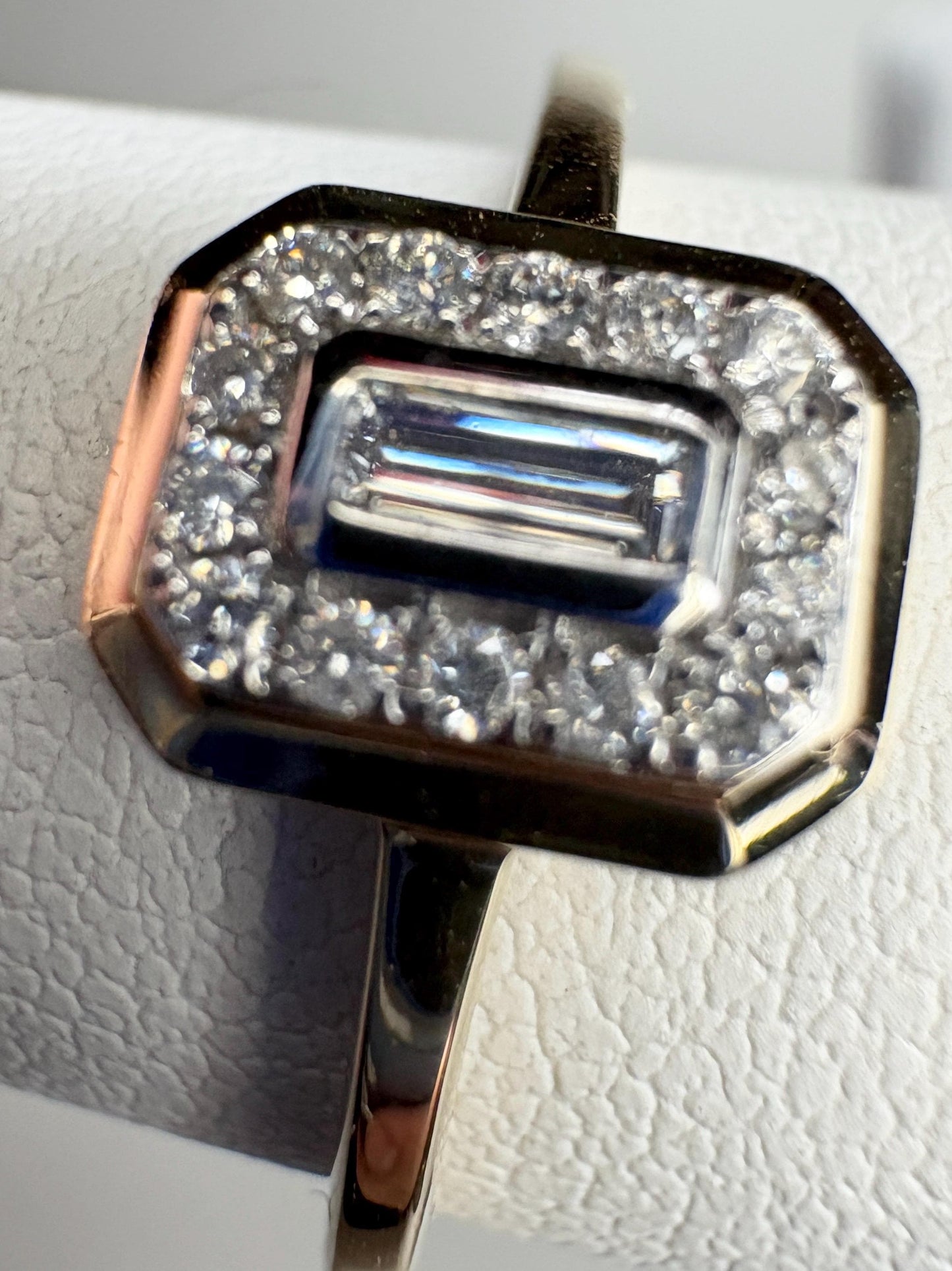 Effy 14k yellow gold ring with a bezel-set baguette diamond surrounded by a halo of smaller diamonds.