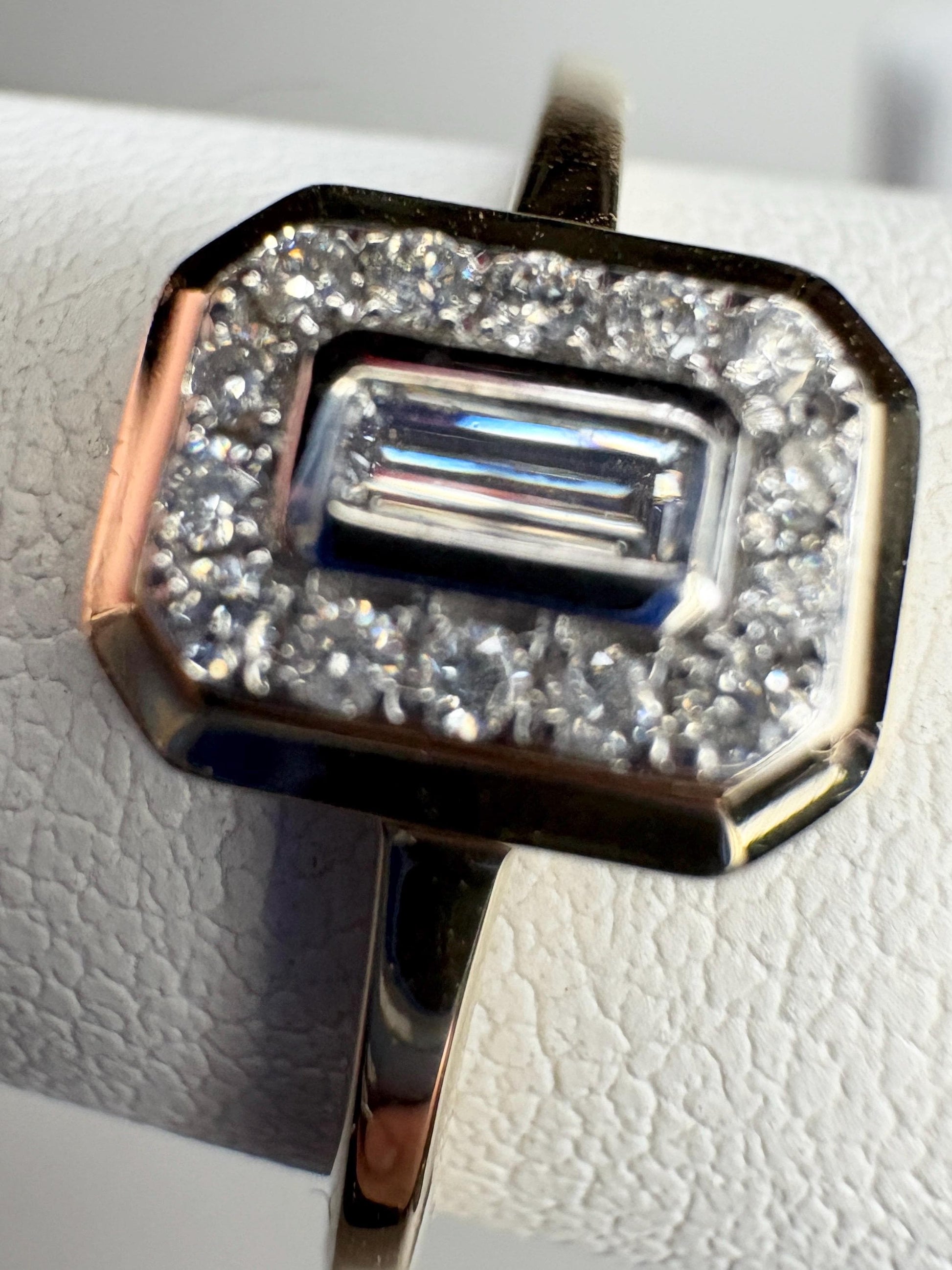 Effy 14k yellow gold ring with a bezel-set baguette diamond surrounded by a halo of smaller diamonds.