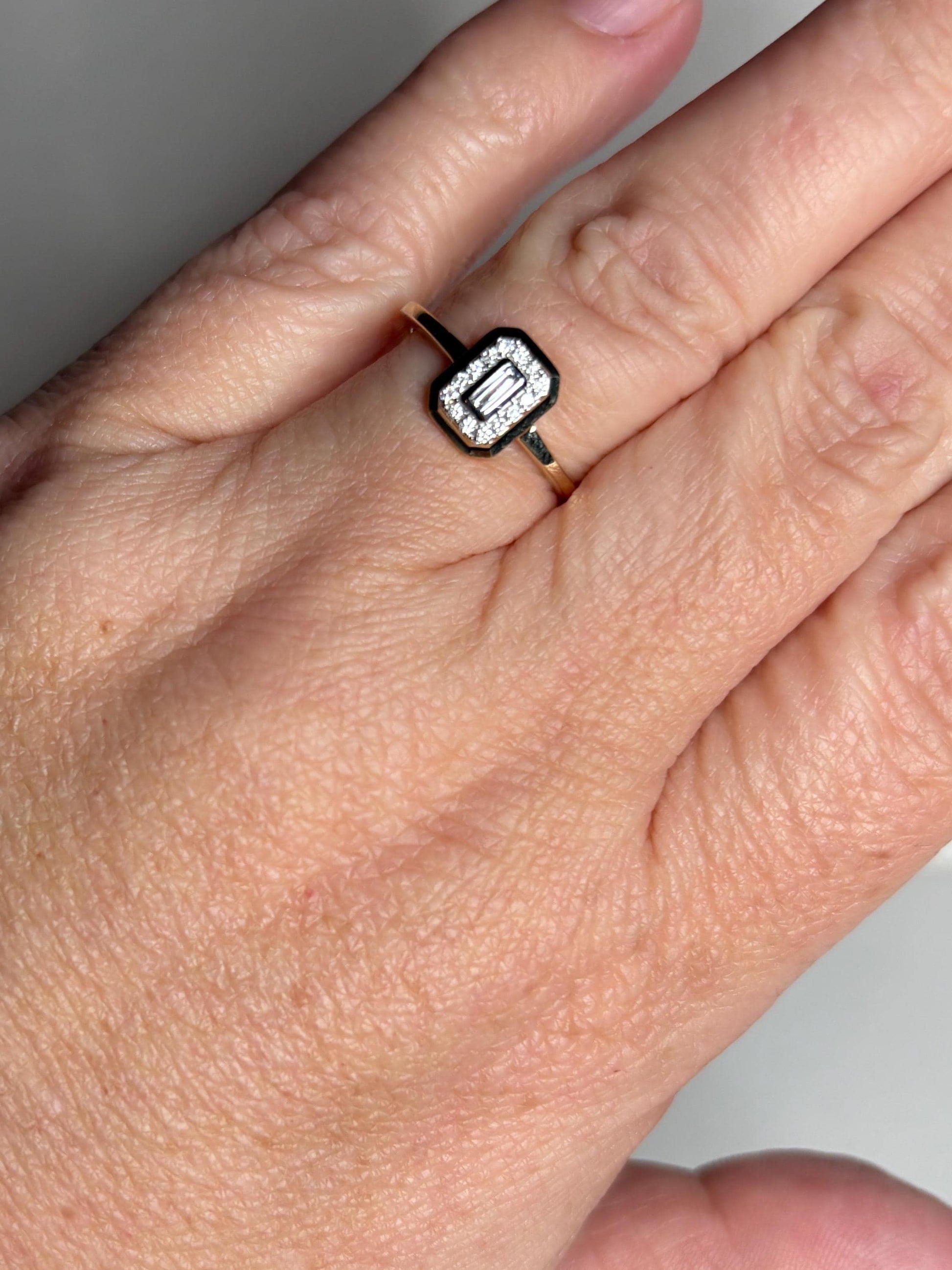 Effy 14k gold ring with bezel-set baguette and round diamonds.