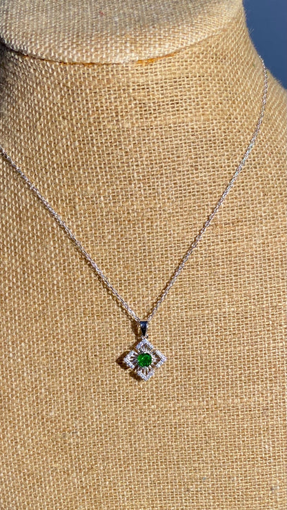 Sterling silver necklace with a square sunbeam pendant featuring a green chrome diopside and cz accents.