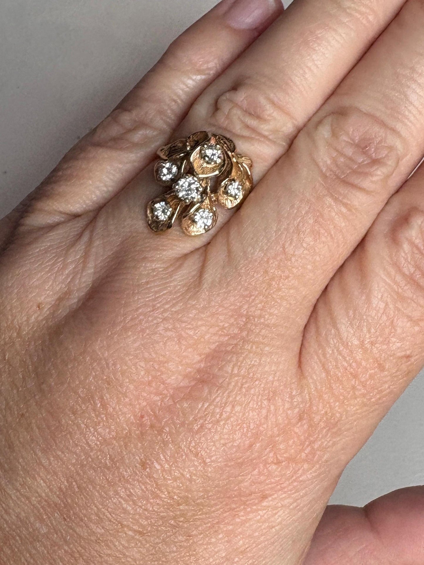 Mid Century 14k gold ring with cascading floral lilies and .75ctw diamonds.
