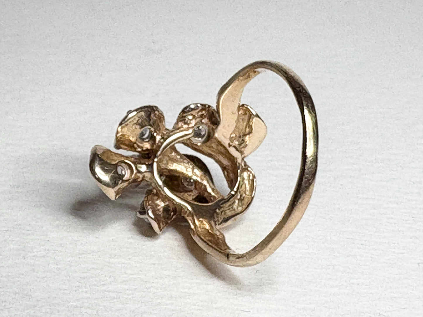 Mid Century 14k gold ring with cascading floral lilies and diamonds.